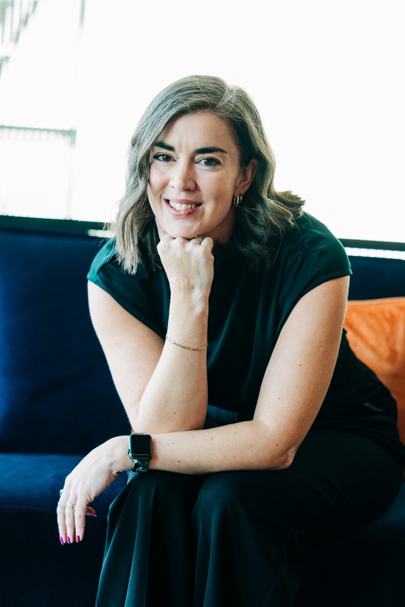 Portrait of Jancis Dunn in sunlight, smiling
